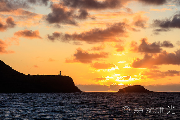 Kilauea Point and Setting Sun in the Distance
