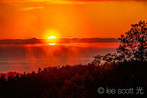 Sunset burn Orange as Afternoon Showers Rise